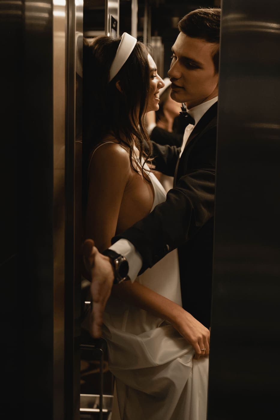 A couple embracing in formal wear