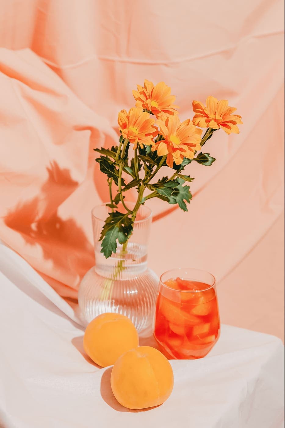 A vase of bright orange blooms